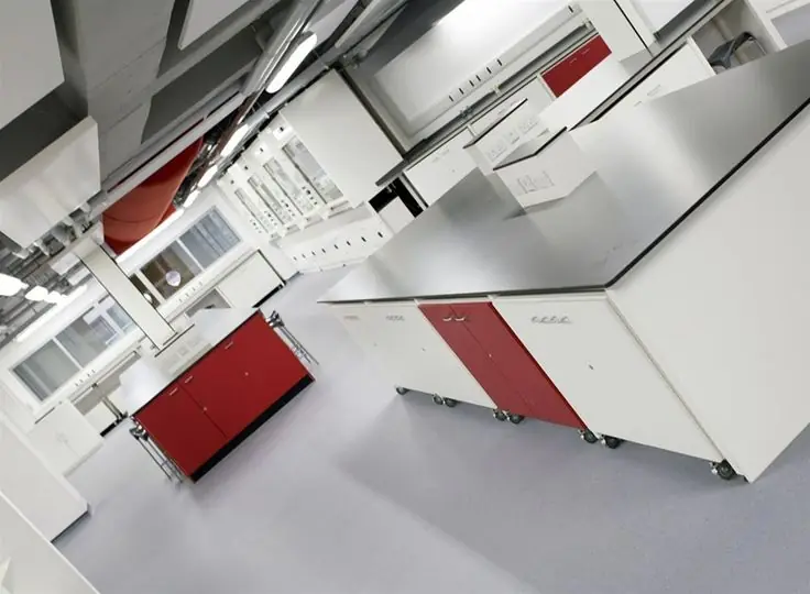 Laboratory furniture with white and red modular cabinets