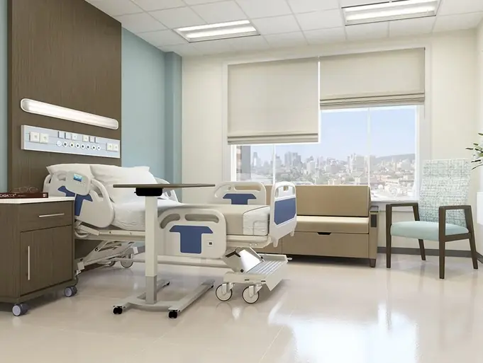 Private patient room with hospital bed, wall-mounted services and seating